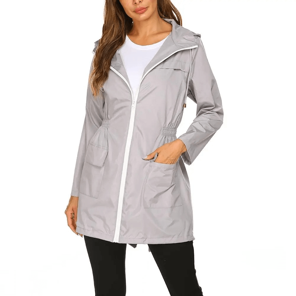 Women's lightweight hooded raincoat jacket SF1926 in gray, featuring water-repellant fabric, asymmetrical cut, and zippered closure.